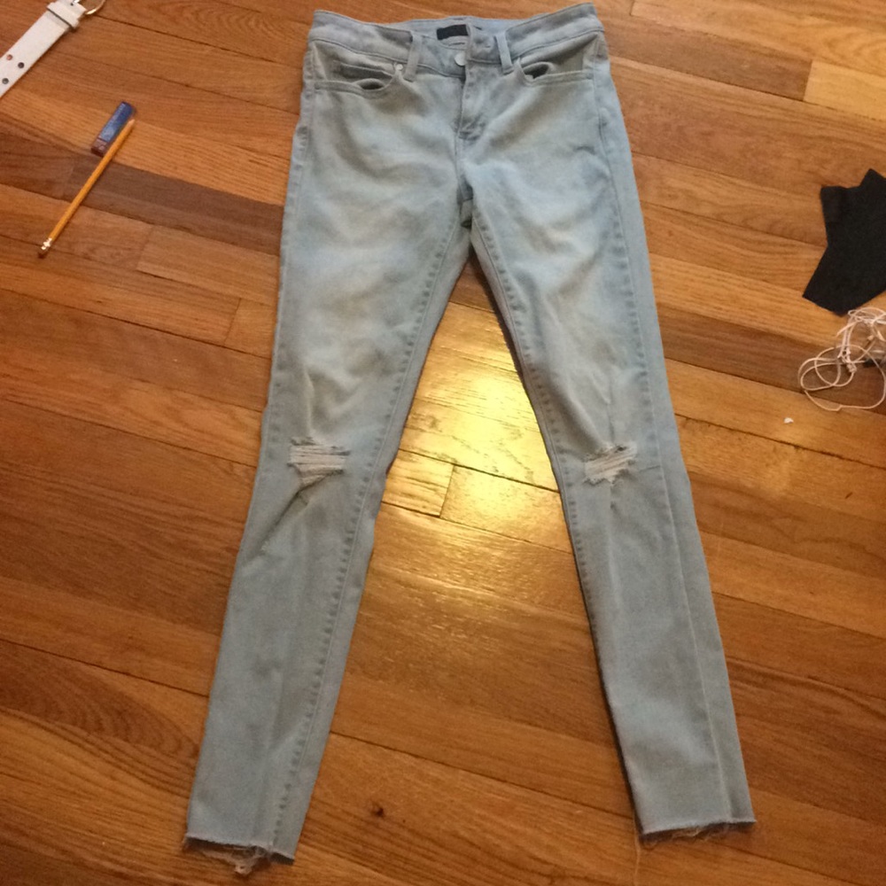 Uniqlo jeans with rips in the knee